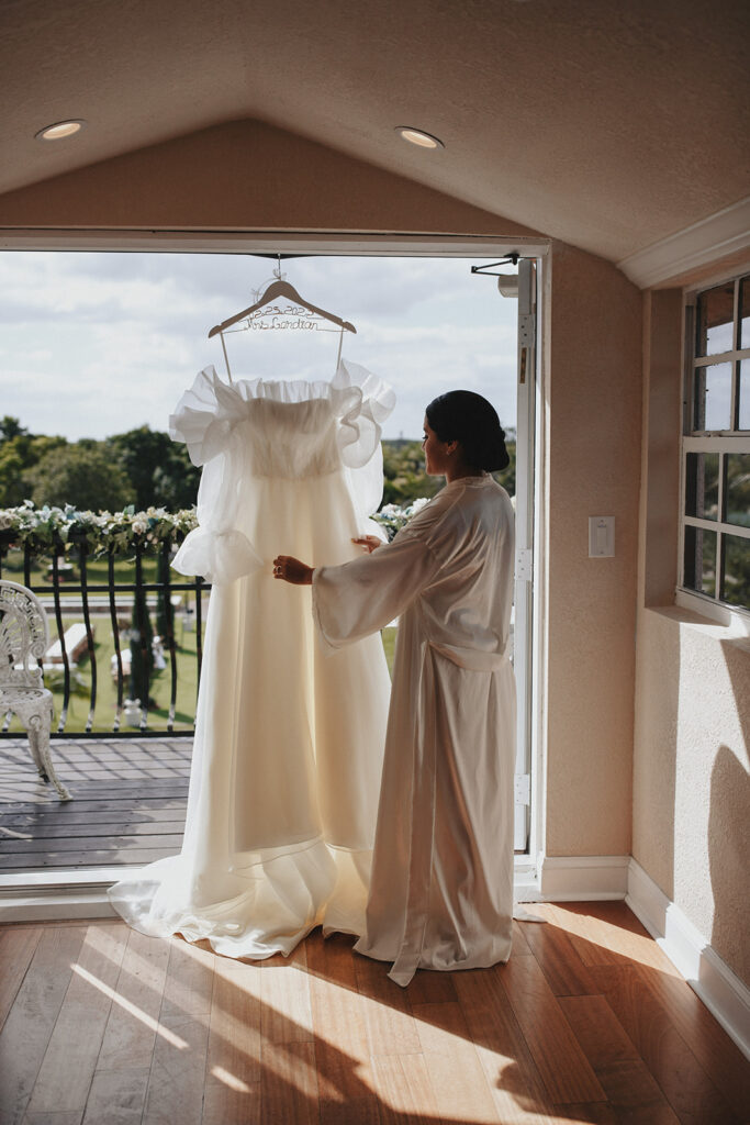 Bride with her wedding dress before getting married.
