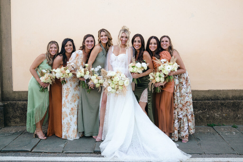 Bride with her bridesmaids at italian wedding 
