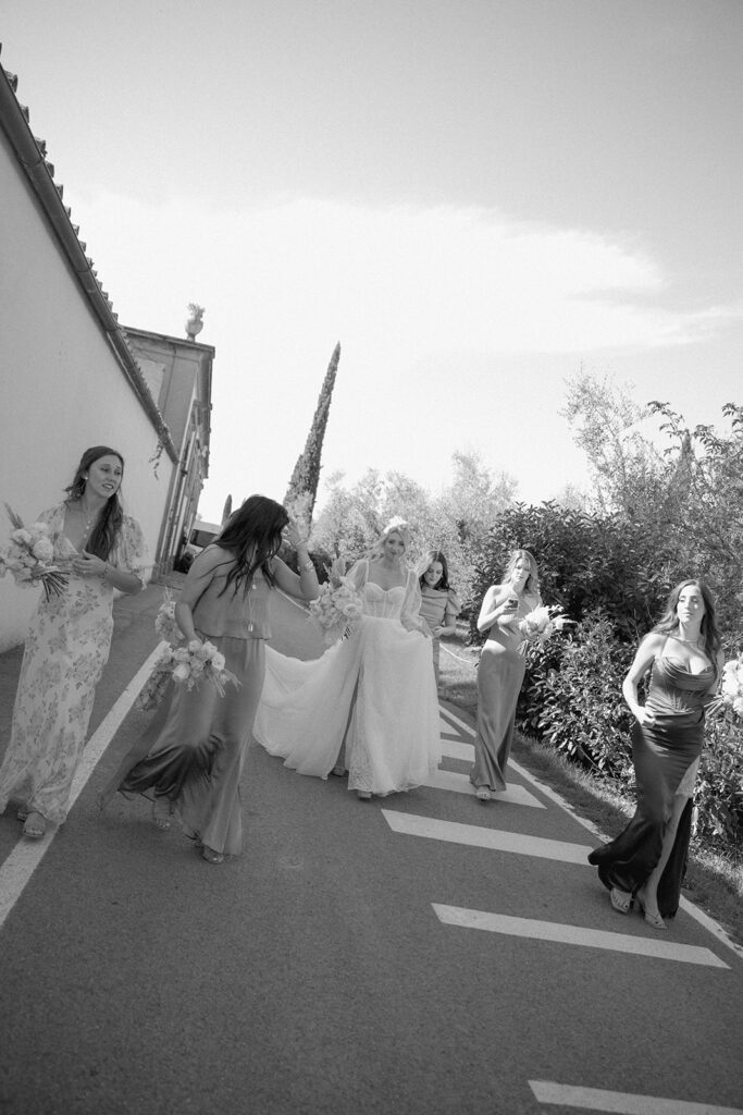 Bride and bridesmaids walking to the ceremony 