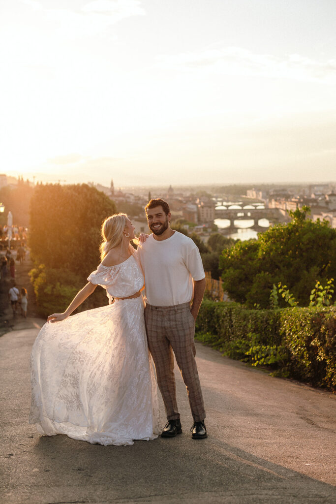 Bride and groom walking around Tuscany for rehearsal dinner 