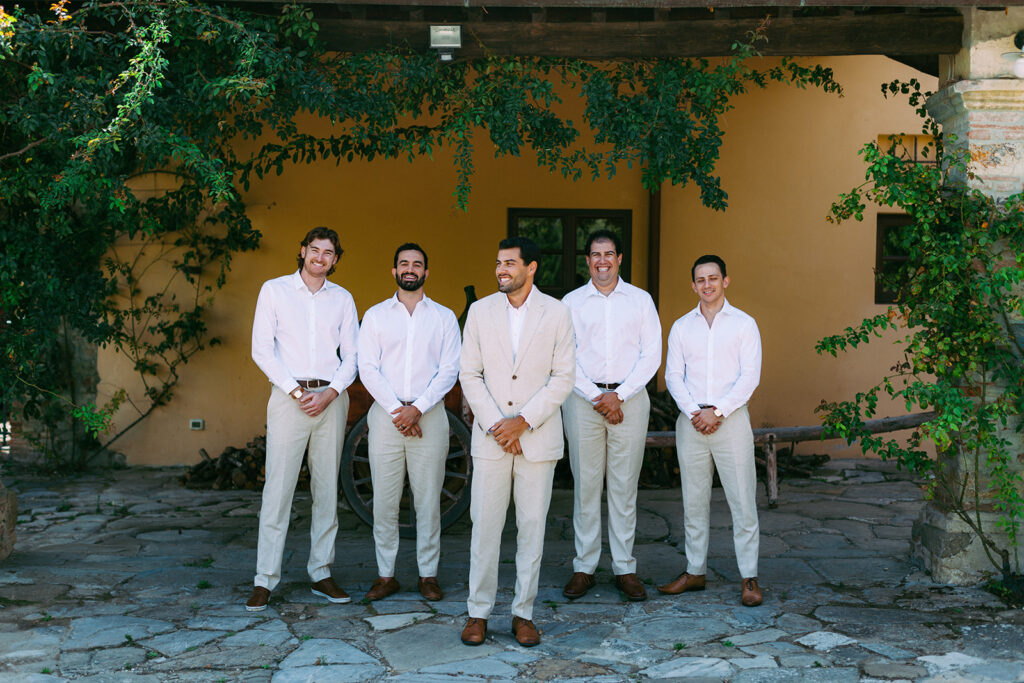 Groom with groomsmen at italian wedding 
