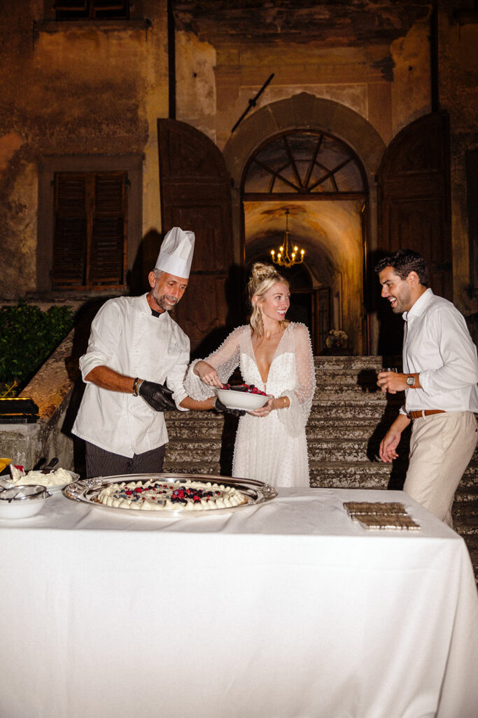 bride and groom help make dessert at italian wedding 