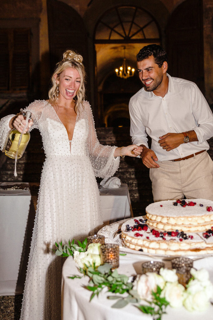 bride and groom help make dessert at italian wedding 