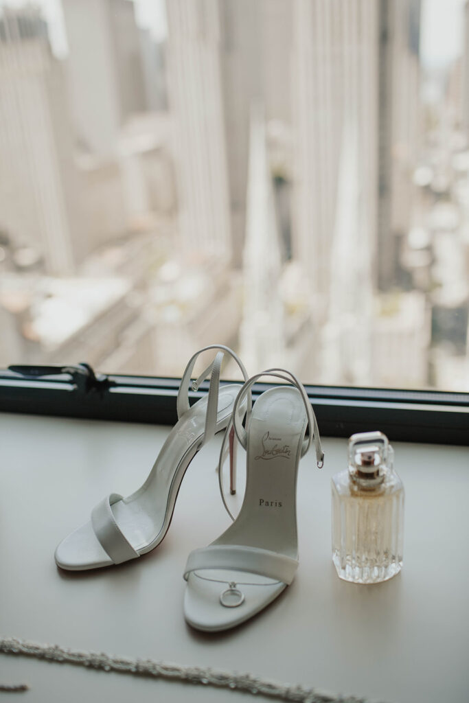 Brides shoes, ring, and perfume 
